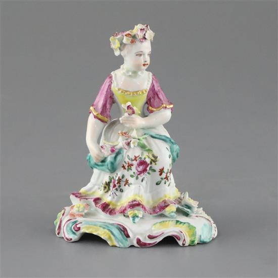 A Derby pale family figure of a seated lady, c.1756-8, H. 11cm